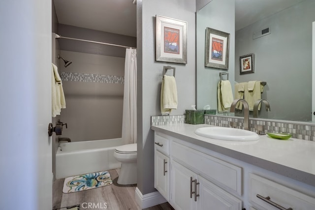 27578 Lene, Mission Viejo, CA 92692 - full bath with wood finished floors, toilet, vanity, shower / bath combo with shower curtain, and backsplash