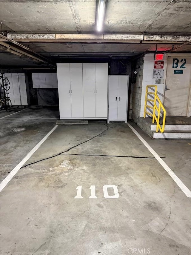 parking deck featuring concrete block wall