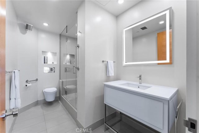 full bath with baseboards, toilet, a stall shower, and vanity