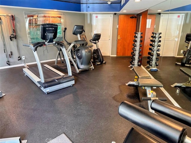 workout area with recessed lighting and baseboards