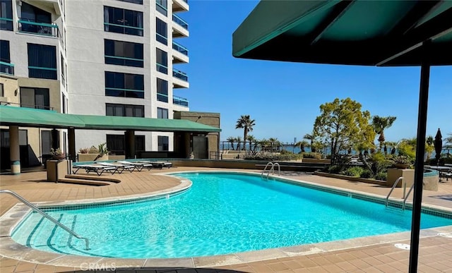 community pool with a patio