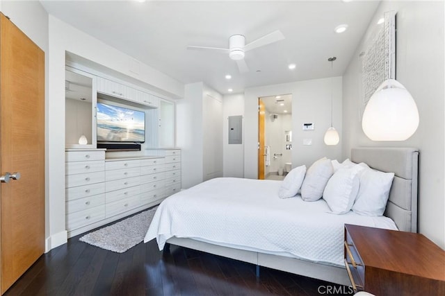 bedroom featuring connected bathroom, ceiling fan, dark wood finished floors, electric panel, and recessed lighting