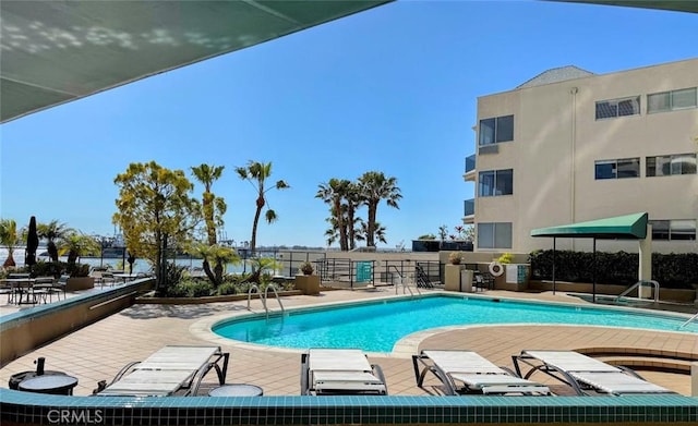 community pool featuring a patio