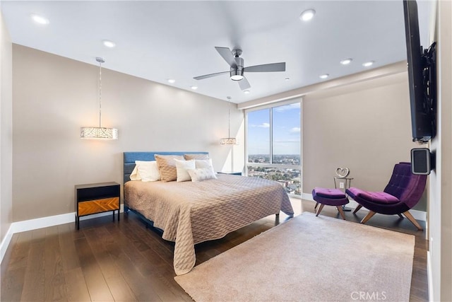 bedroom featuring wood finished floors, baseboards, recessed lighting, ceiling fan, and expansive windows