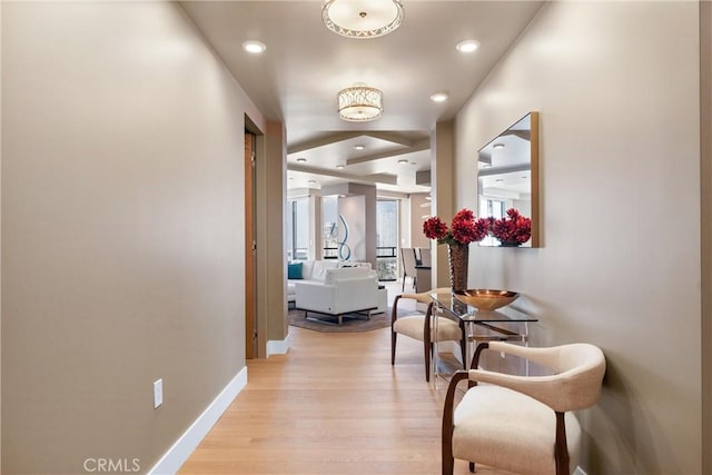 hallway featuring recessed lighting, light wood-type flooring, and baseboards