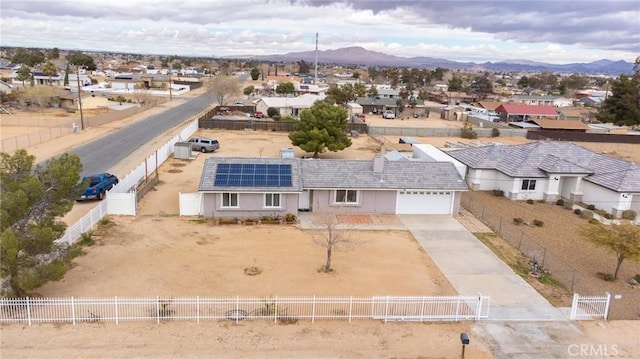 aerial view featuring a mountain view and a residential view