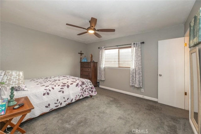 bedroom with a ceiling fan, carpet, and baseboards