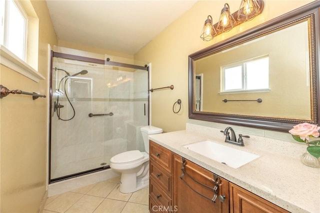 full bathroom featuring vanity, tile patterned floors, toilet, and a stall shower