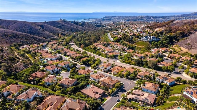 bird's eye view with a residential view and a water view