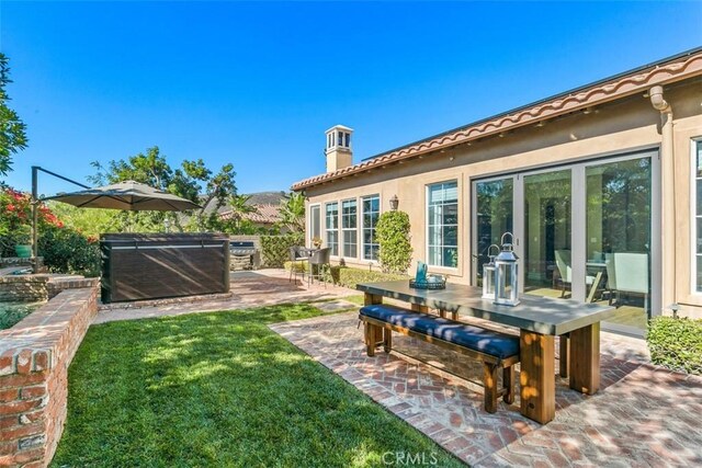 view of yard featuring a patio and outdoor dining area