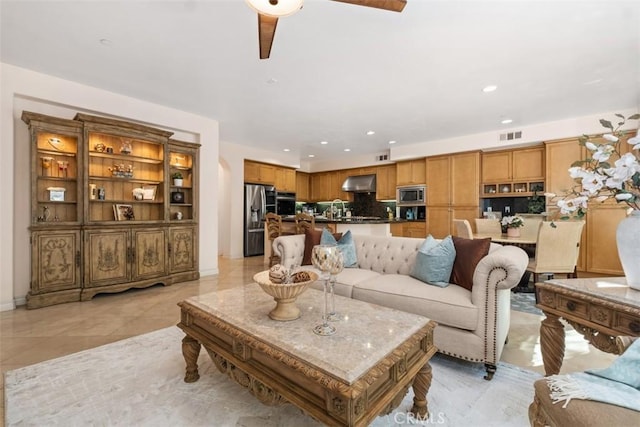 living room with recessed lighting, visible vents, light tile patterned flooring, and ceiling fan