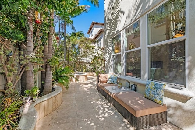 view of patio / terrace featuring fence