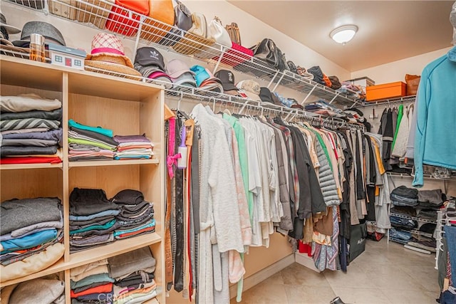 spacious closet with tile patterned flooring