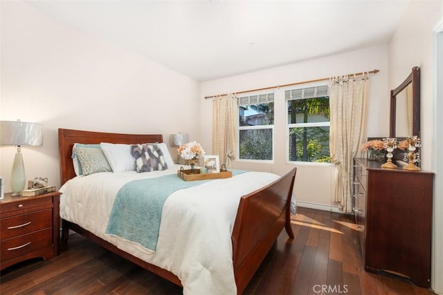 bedroom featuring dark wood-style floors