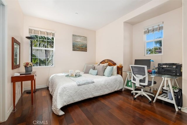 bedroom with hardwood / wood-style flooring