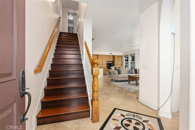 stairs featuring recessed lighting and tile patterned flooring