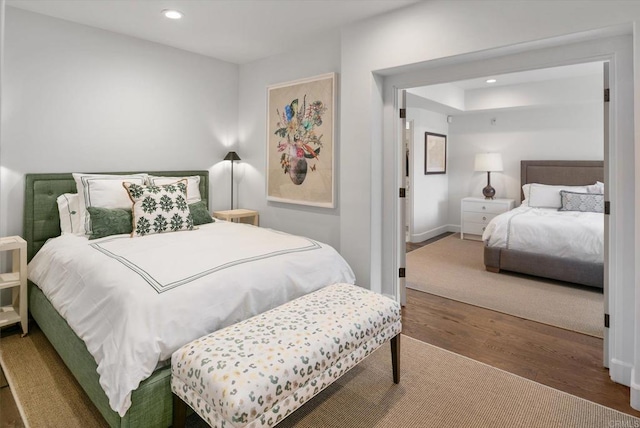 bedroom featuring recessed lighting, baseboards, and wood finished floors