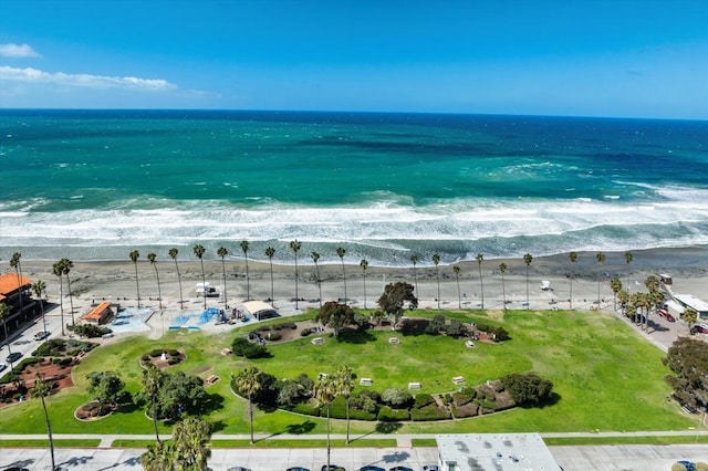 aerial view featuring a water view and a beach view