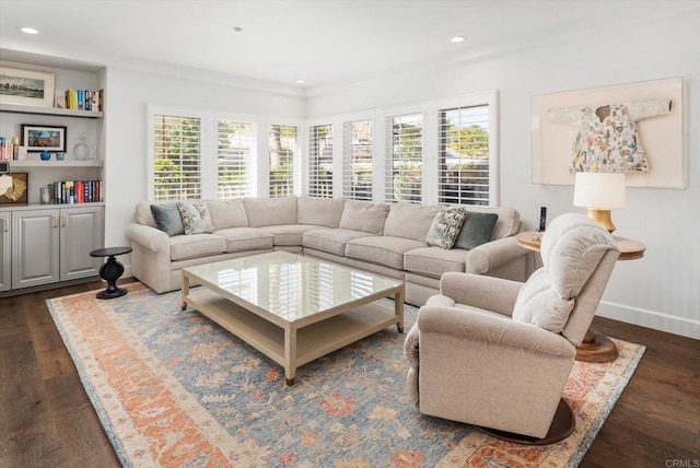 living area featuring recessed lighting, baseboards, and dark wood-style flooring