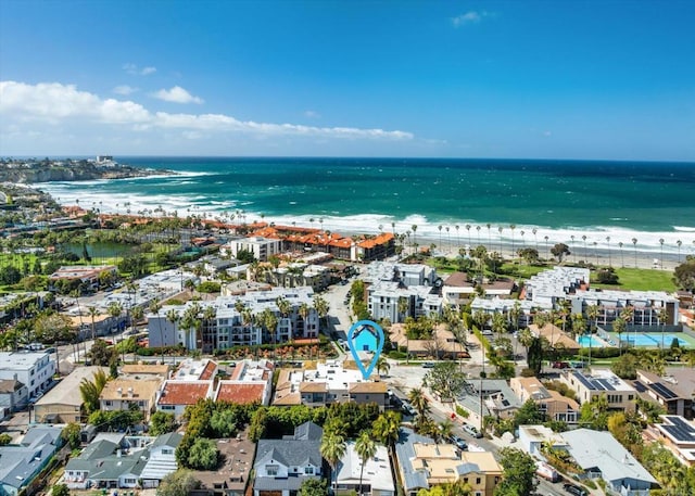 bird's eye view featuring a view of the beach and a water view