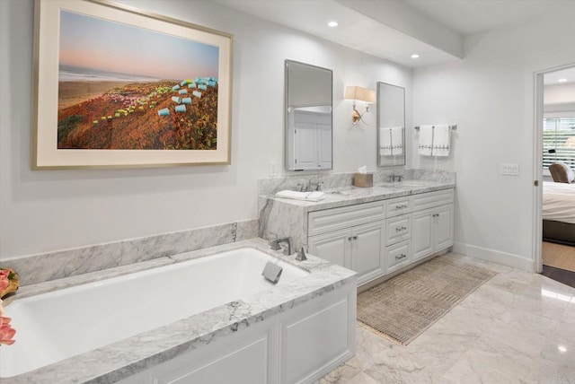 ensuite bathroom with a garden tub, marble finish floor, a sink, connected bathroom, and double vanity