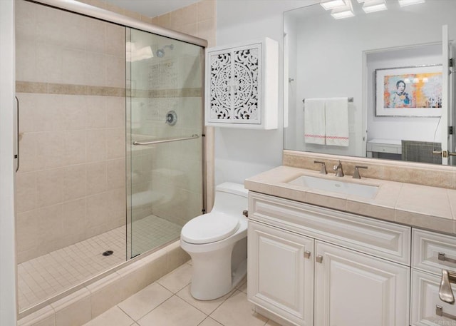 full bath with tile patterned flooring, a stall shower, toilet, and vanity