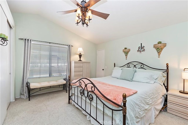 carpeted bedroom featuring ceiling fan and lofted ceiling