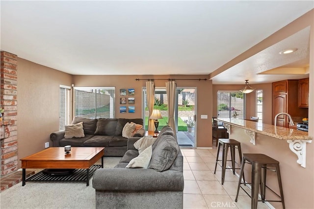 living area with light tile patterned floors