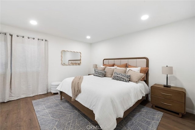 bedroom with recessed lighting and wood finished floors