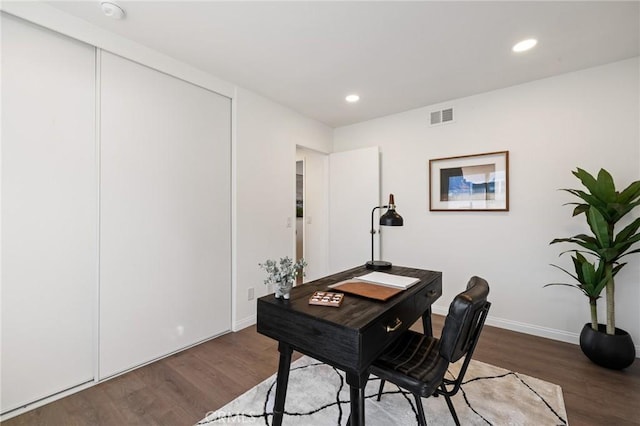 office area featuring recessed lighting, visible vents, baseboards, and wood finished floors