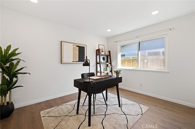 office featuring recessed lighting, wood finished floors, and baseboards