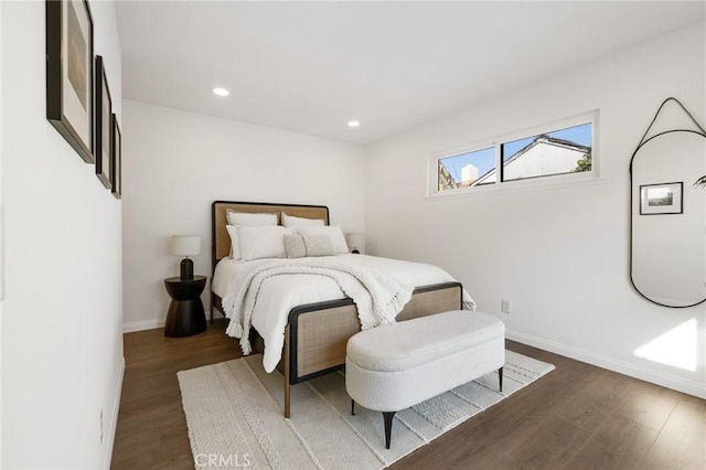 bedroom featuring recessed lighting, wood finished floors, and baseboards