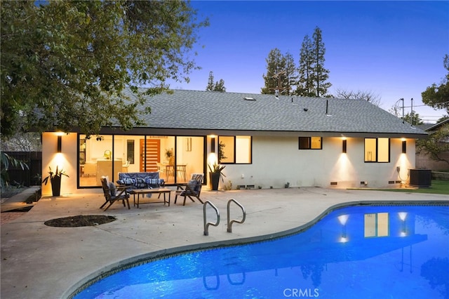 outdoor pool with cooling unit, an outdoor hangout area, and a patio