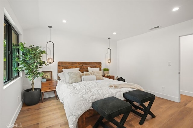 bedroom with recessed lighting, light wood-style floors, visible vents, and baseboards