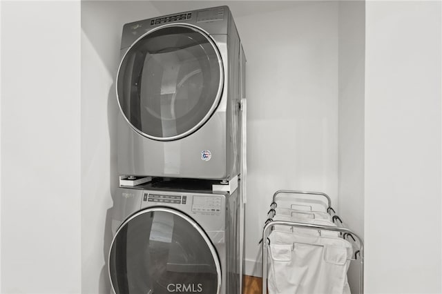 laundry room with laundry area and stacked washing maching and dryer