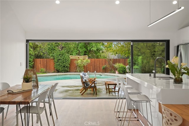 view of pool featuring a sink