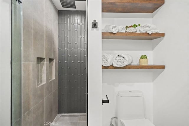 full bath featuring a tile shower