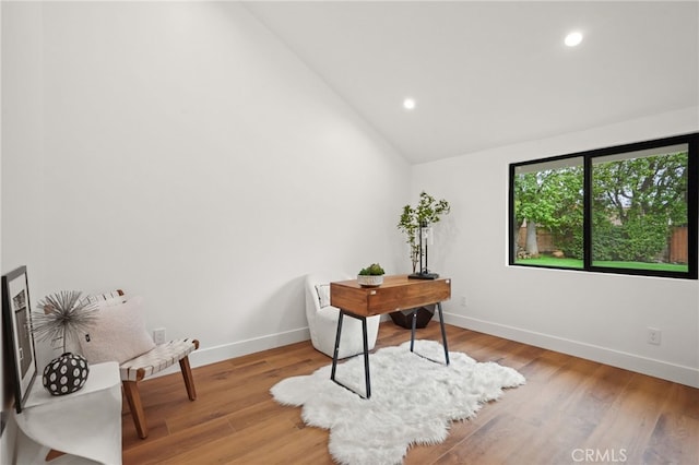 office with recessed lighting, light wood-type flooring, baseboards, and lofted ceiling