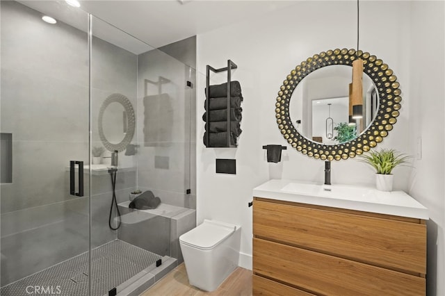 full bathroom with a shower stall, toilet, and vanity