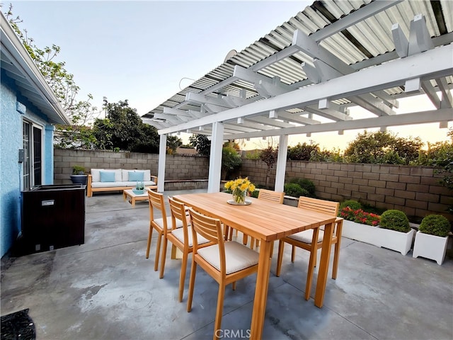 view of patio with outdoor dining space, outdoor lounge area, a fenced backyard, and a pergola