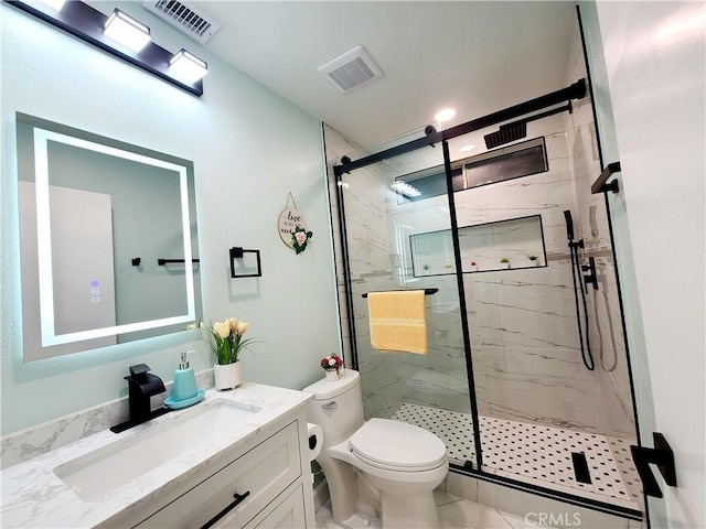 full bath featuring a marble finish shower, visible vents, toilet, and vanity