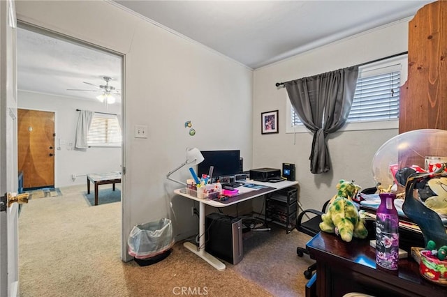 carpeted office featuring a ceiling fan