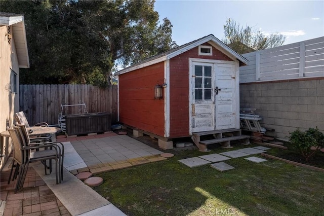 view of shed featuring a fenced backyard