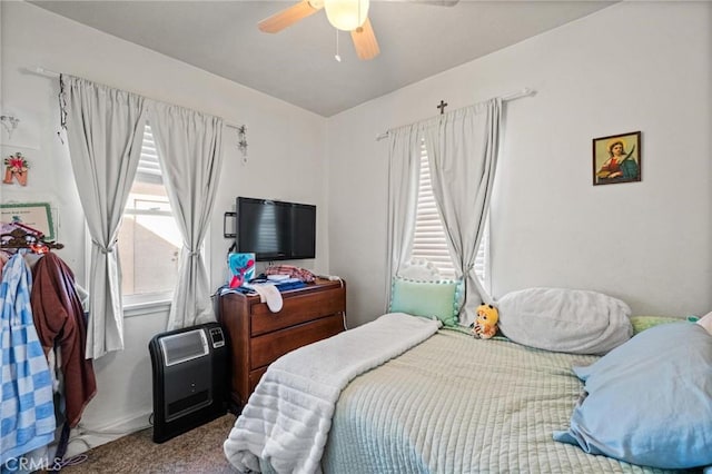 carpeted bedroom with a ceiling fan