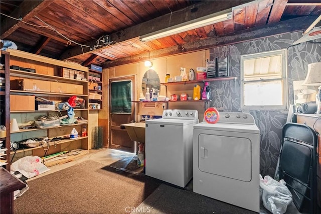 laundry room with washer and dryer, wooden ceiling, and wallpapered walls