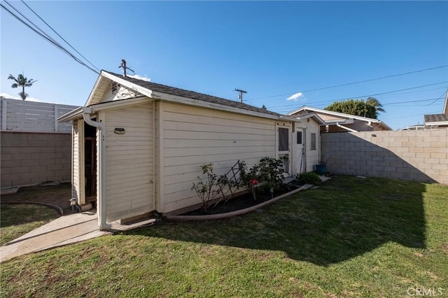 exterior space with a yard and fence