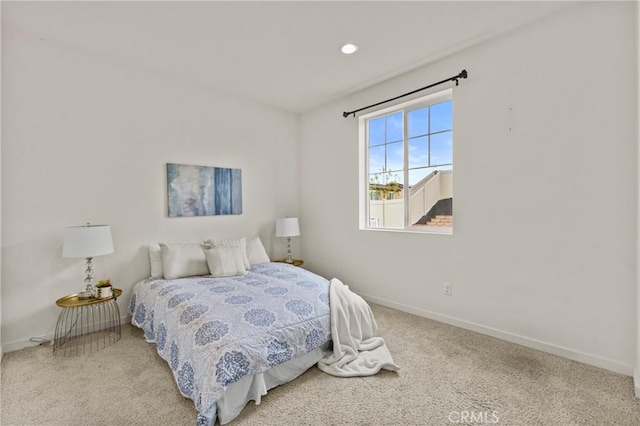 carpeted bedroom with recessed lighting and baseboards