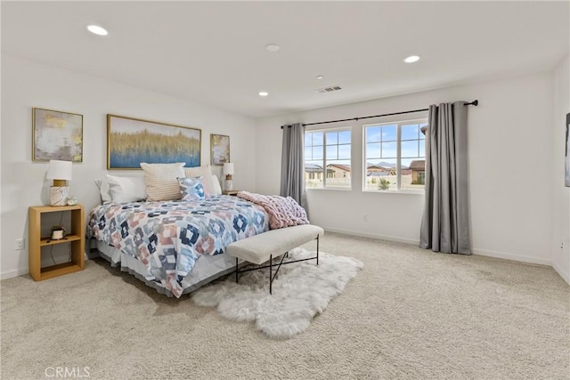 carpeted bedroom with recessed lighting, visible vents, and baseboards