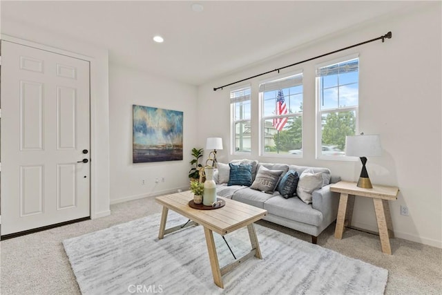 carpeted living room featuring recessed lighting and baseboards