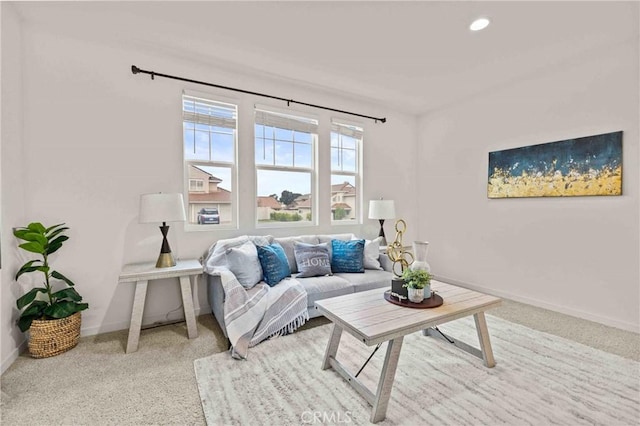 living room featuring recessed lighting, baseboards, and carpet floors